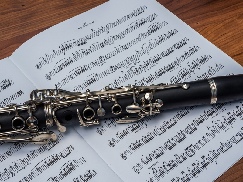 audition Picture of sheet music on a table with clarinet laying across the top